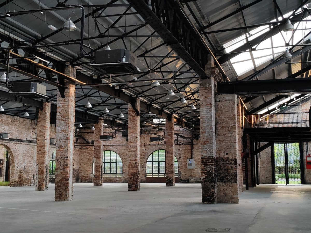 Adaptive-reuse commercial interior with structural bays and open floor space