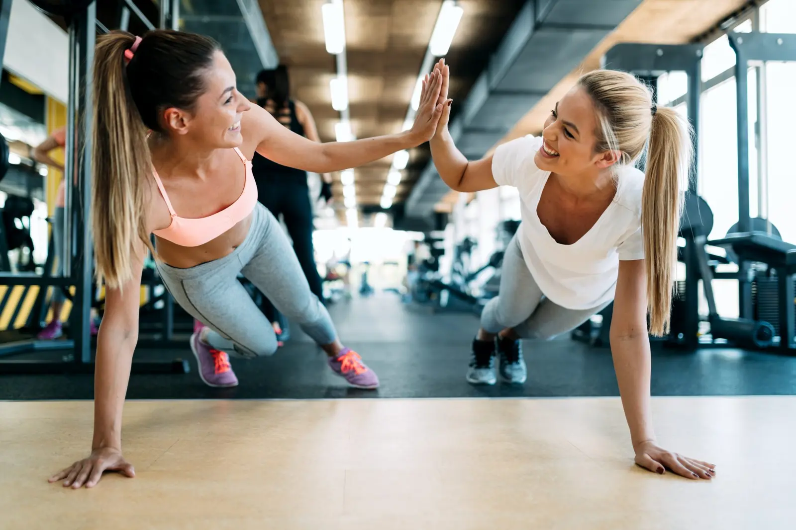 Two CRAYS members celebrating a workout together