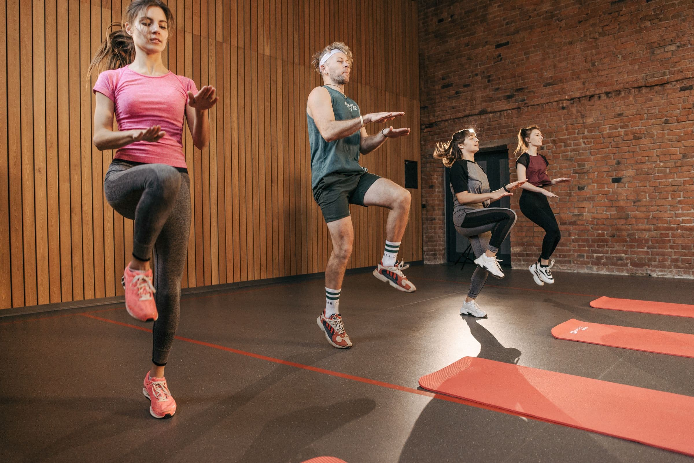 Athlete training independently in a functional gym area